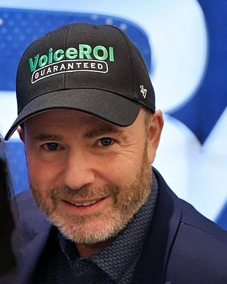 Close-up of Mike Weiss in a VoiceROI Guaranteed cap