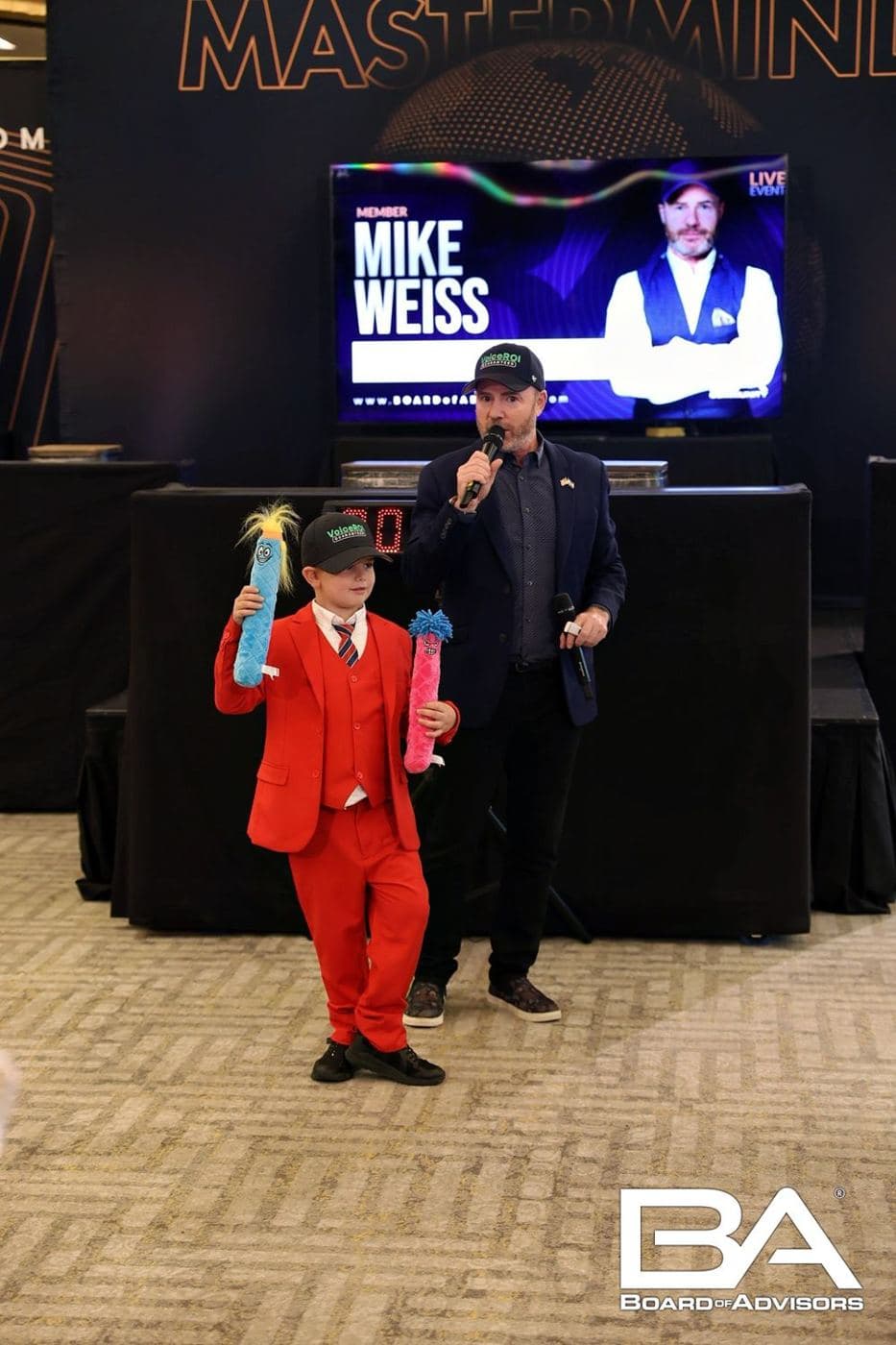 Mike Weiss on stage with his son